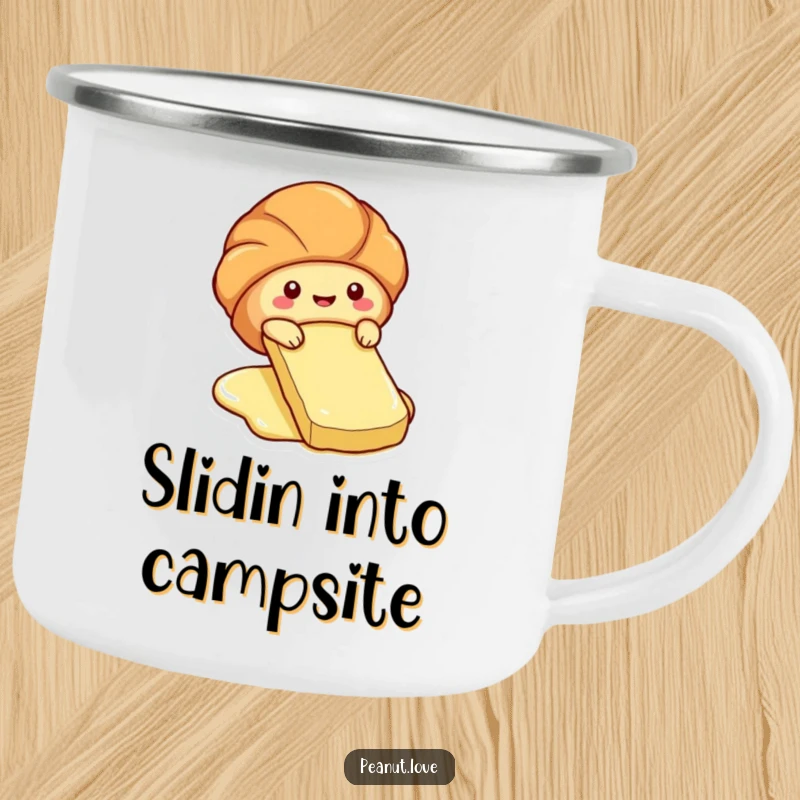 Funny camping mug of a cute croissant character sliding down a butter pat.