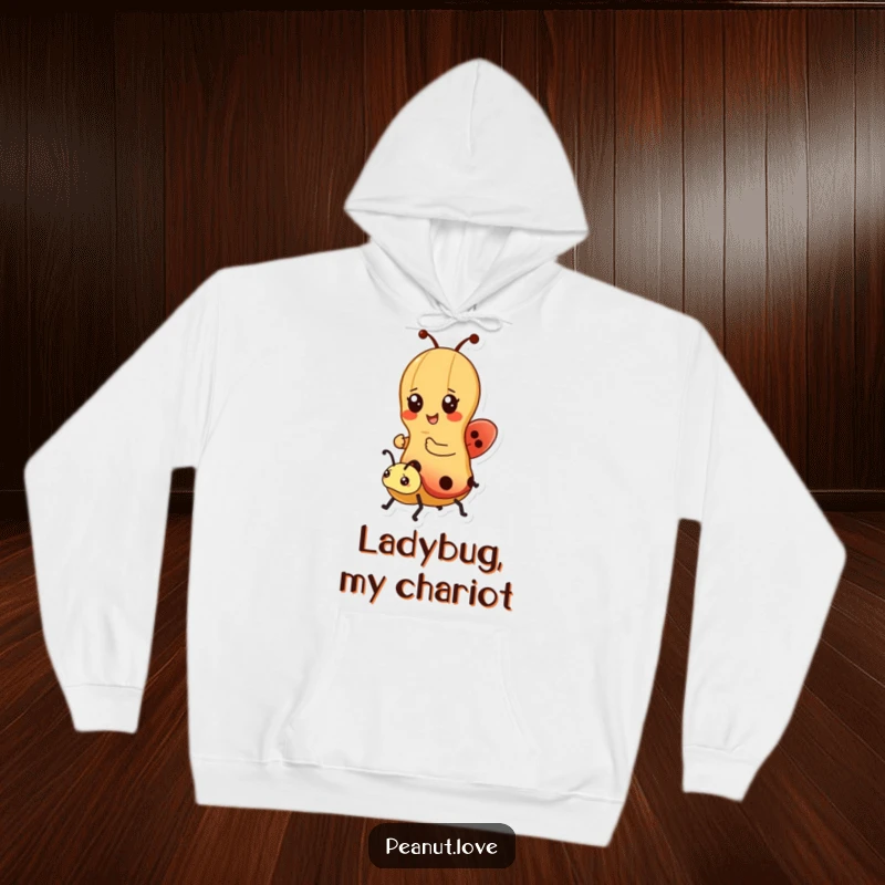 Funny hoodie depicting a kawaii peanut character joyfully riding a ladybug, offering warmth and whimsical charm; ideal for gifting.