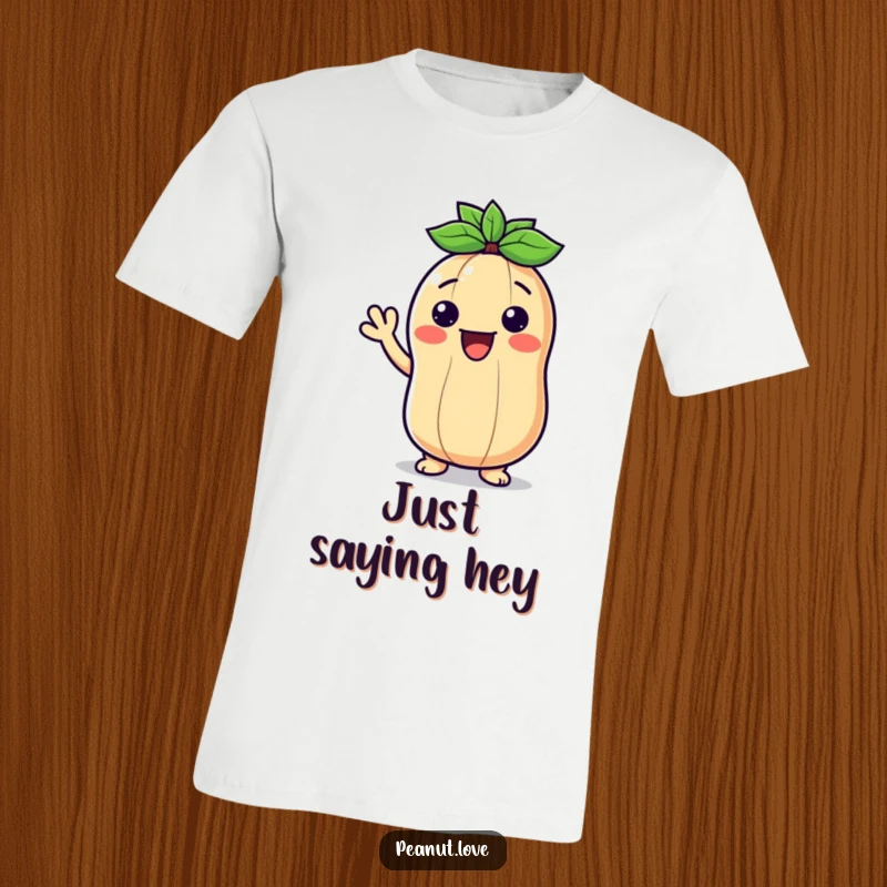 Funny t-shirt showcasing a smiling Kawaii peanut character giving a warm, friendly wave, radiating happiness.