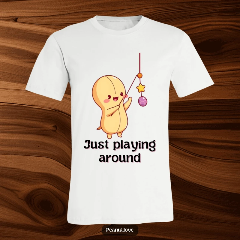 Funny peanut character energetically batting at a dangling string on a t-shirt, symbolizing playful joy and engagement.