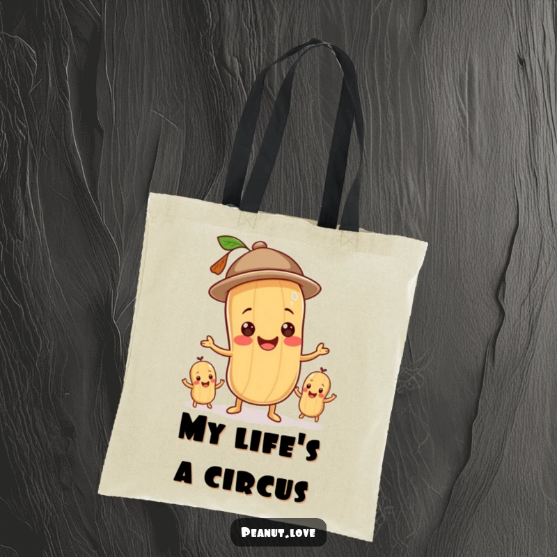 Funny tote bag illustrating a smiling peanut in a hat juggling smaller peanuts, perfect for groceries.