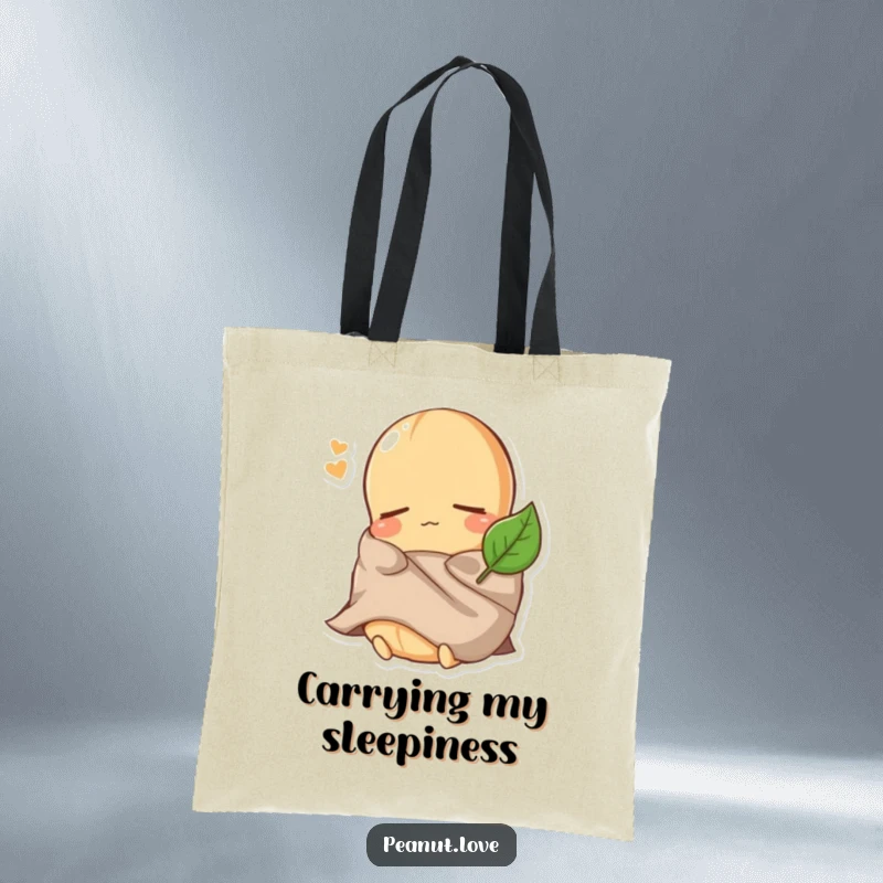 Funny Peanut Tote Bag: A sleepy peanut character is bundled under a tiny leaf blanket, ready to carry your items for a restful day.